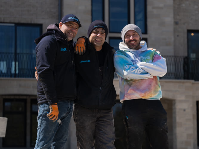 The AVAS Automation team in front of a luxury home they secured in King City, Ontario