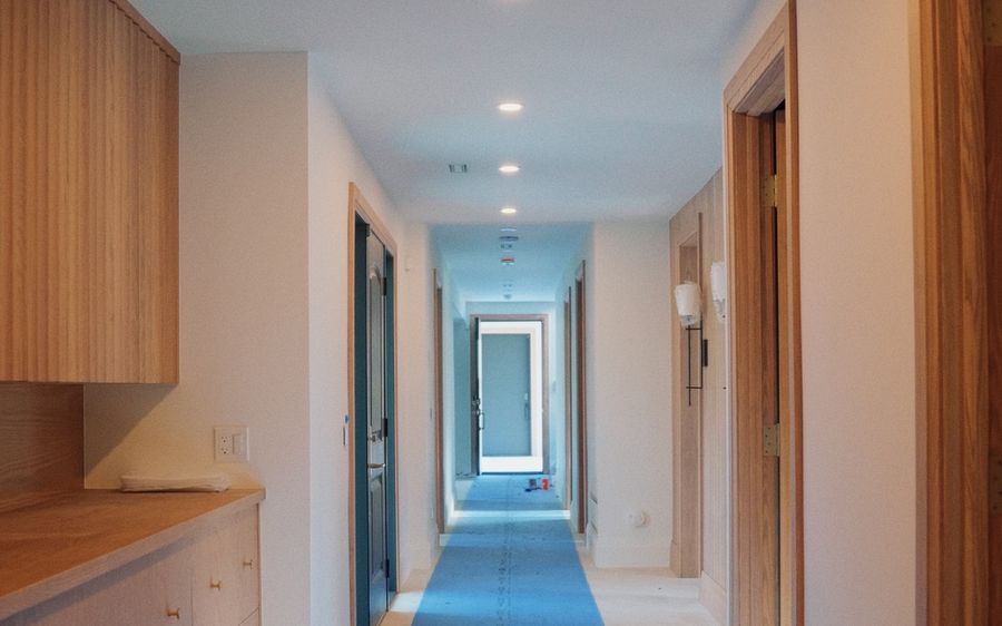 Long hallway with recessed lighting in a new build in Collingwood