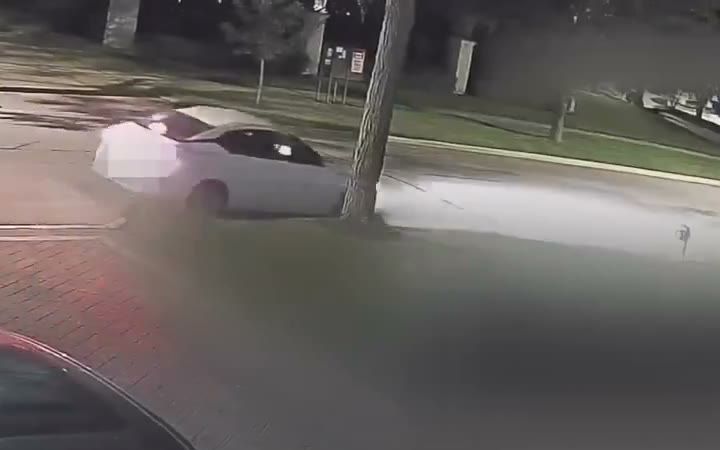 Security camera footage of a driveway at night