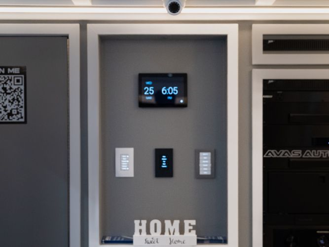 Control4 touchscreen and keypads on the control wall inside the AVAS home automation trailer