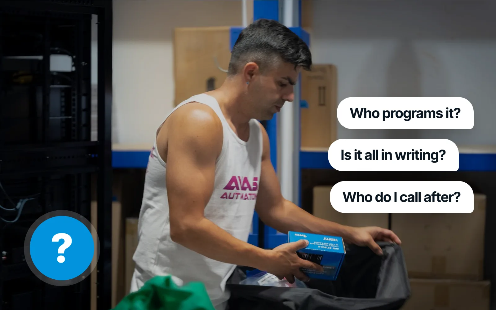 An AVAS team member packing gear in the warehouse, with three questions: Who programs it? Is it all in writing? Who do I call after?